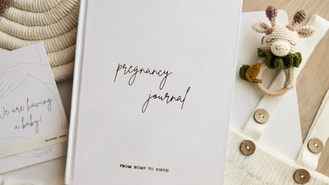Pregnancy journal with gold foil cover and weekly tracking pages