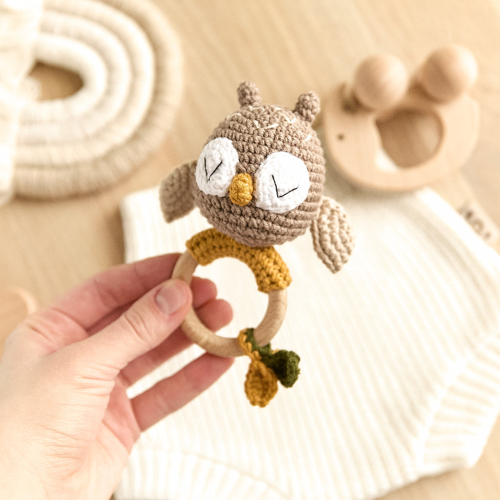 Handmade crochet owl baby rattle with mustard accents and natural wooden teething ring