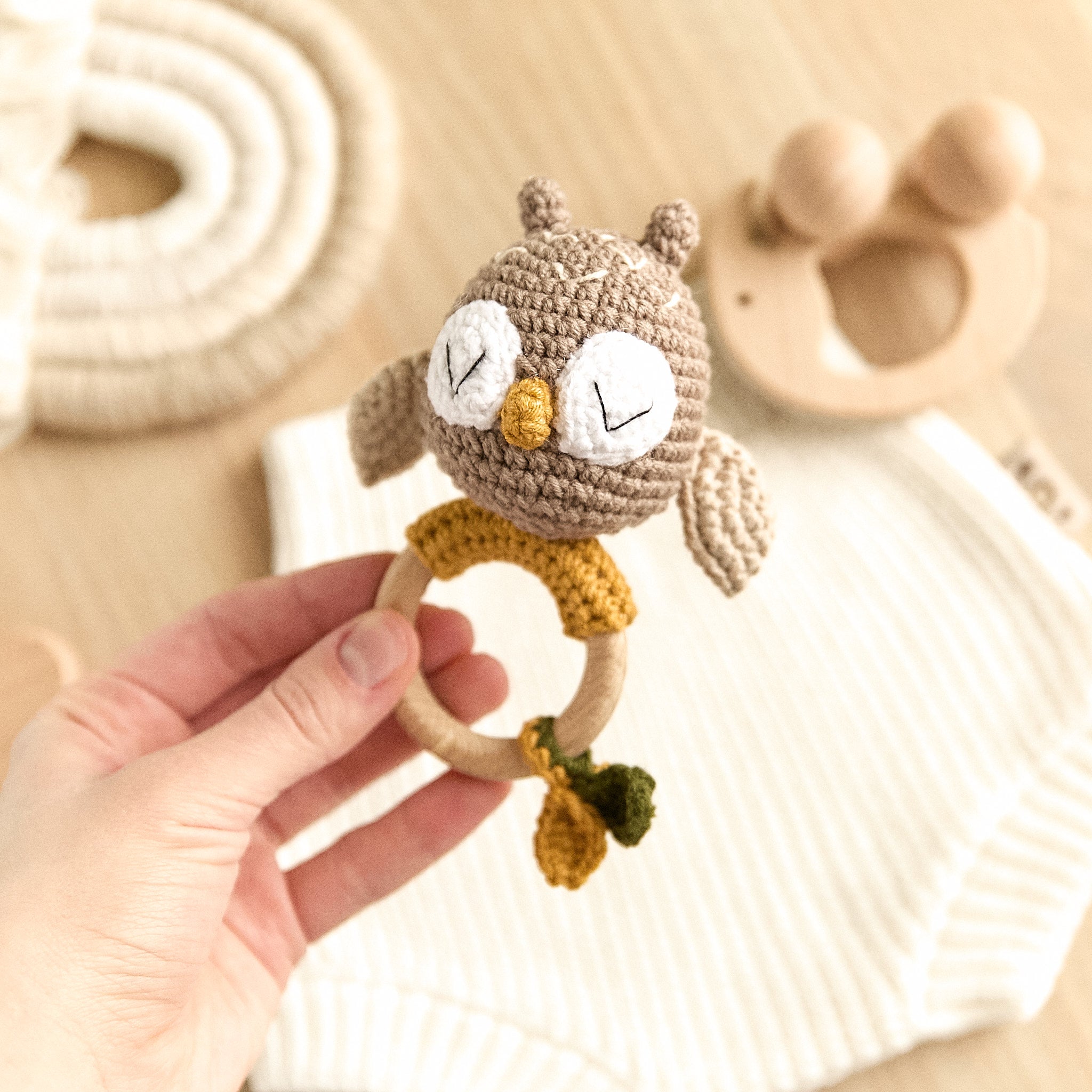 Handmade crochet owl baby rattle with mustard accents and natural wooden teething ring