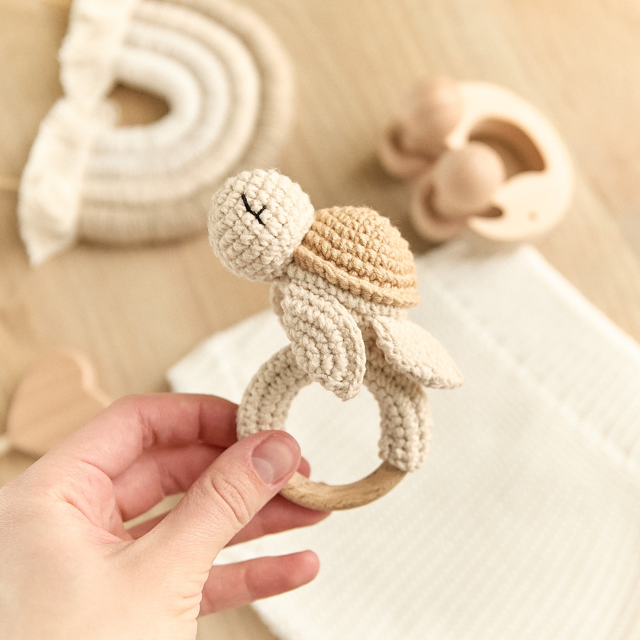 Handmade crochet turtle baby rattle with natural wooden teething ring