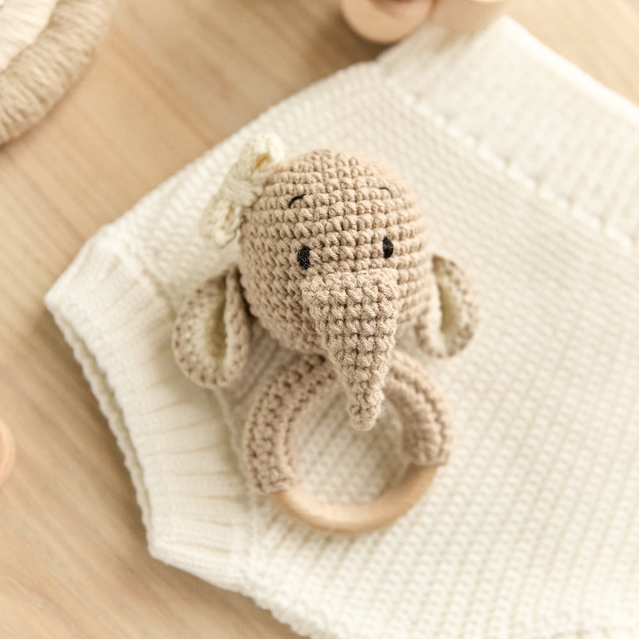 Handmade crochet elephant baby rattle with natural wooden teething ring