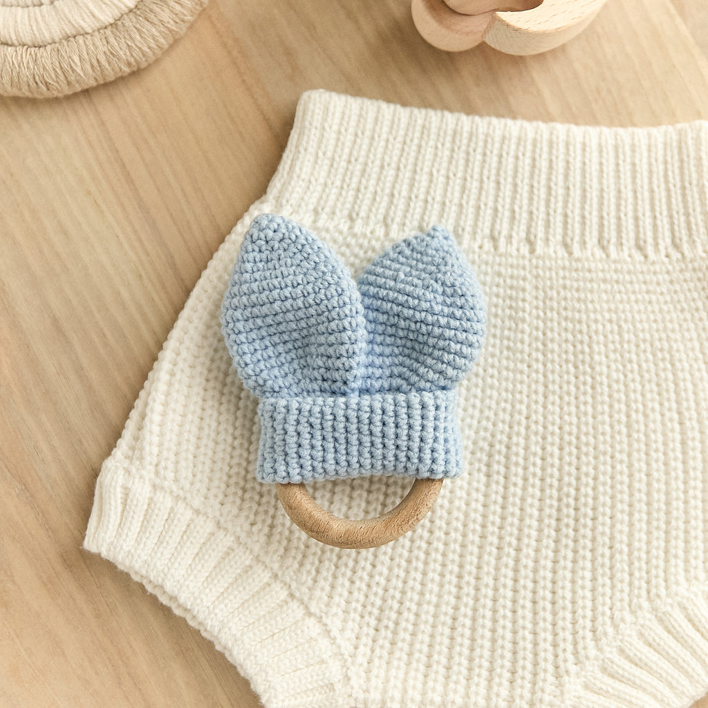 Crochet blue bunny ear teether with natural wooden ring — newborn sensory toy