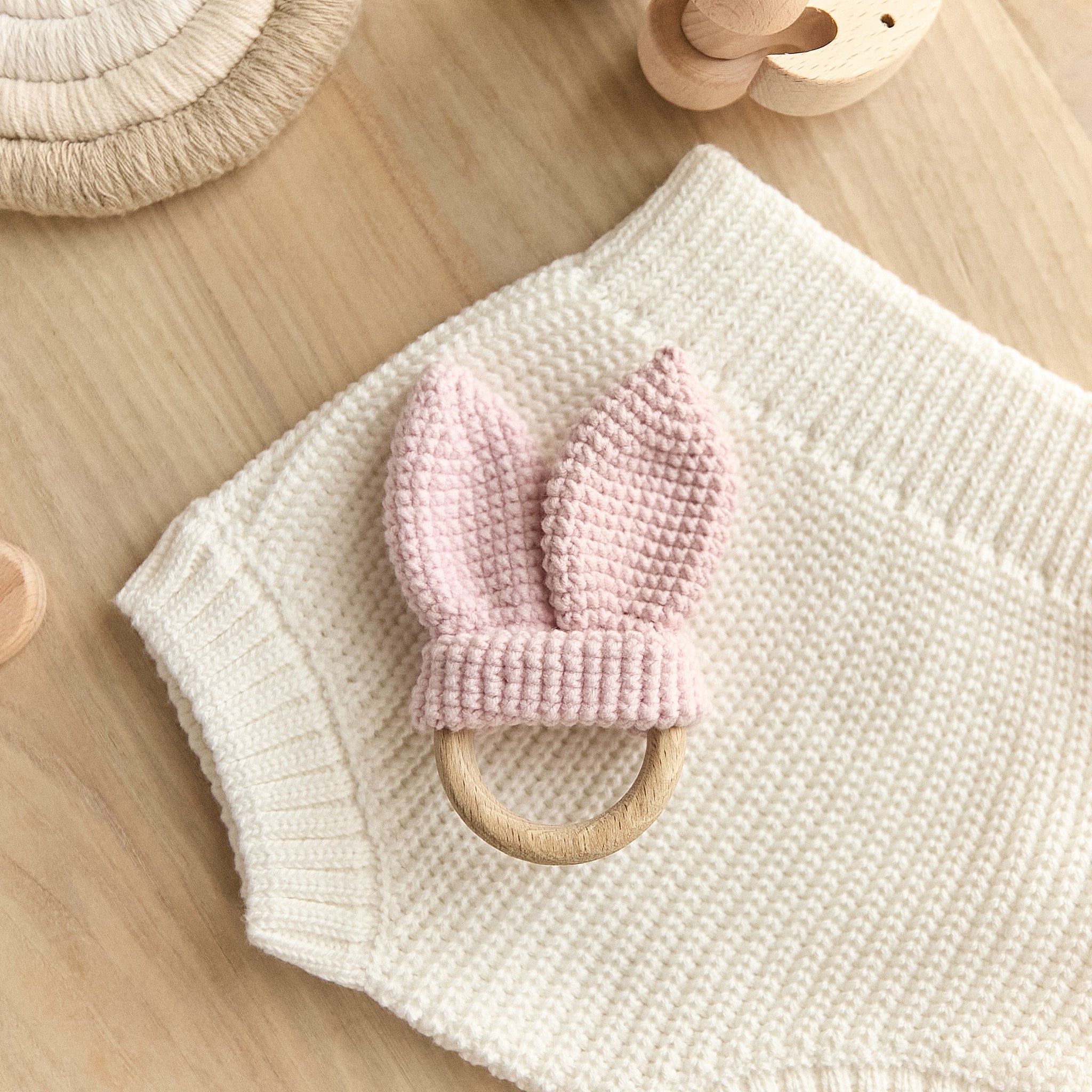 Crochet pink bunny ear teether with natural wooden ring — baby girl gift