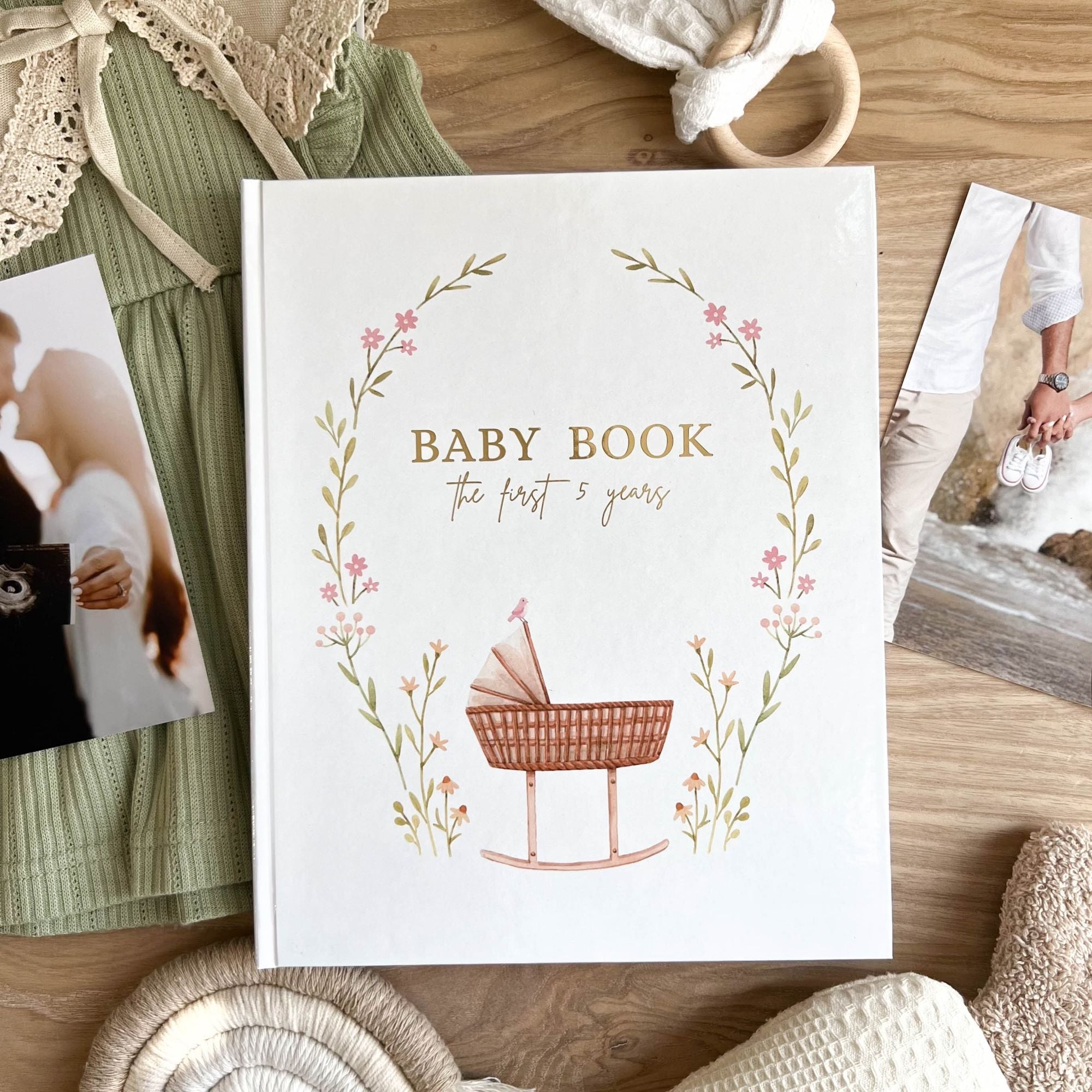 Baby memory book cover design with pink cradle illustration — girl edition