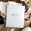 Baby memory book cover variant in classic white linen with gold foil title