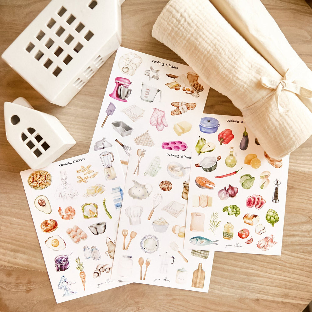 Cooking sticker set spread on table showing full collection of all sheets