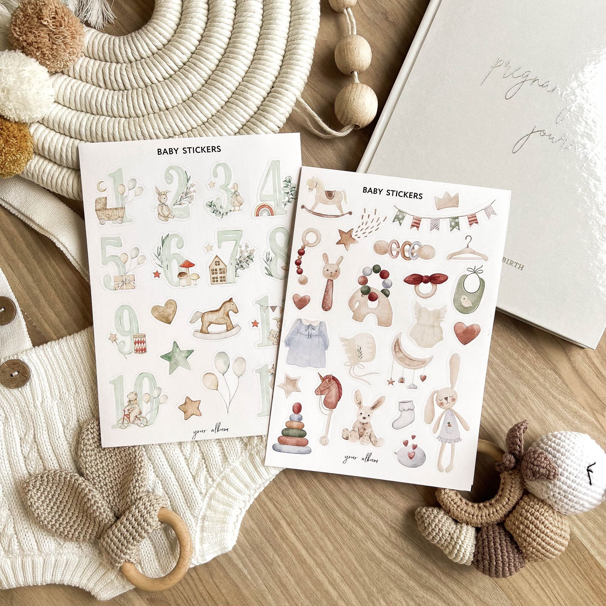 Full set of baby album stickers arranged on table showing all sheet designs