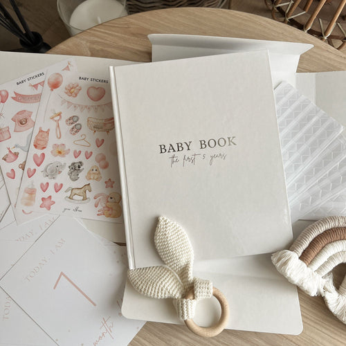 Handmade linen baby memory book with gold foil lettering — first year keepsake gift