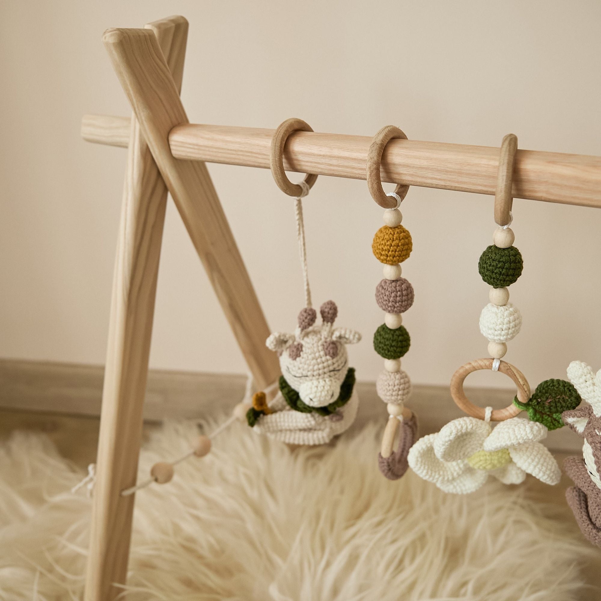 Natural ash wood frame detail of baby gym showing smooth sanded joints