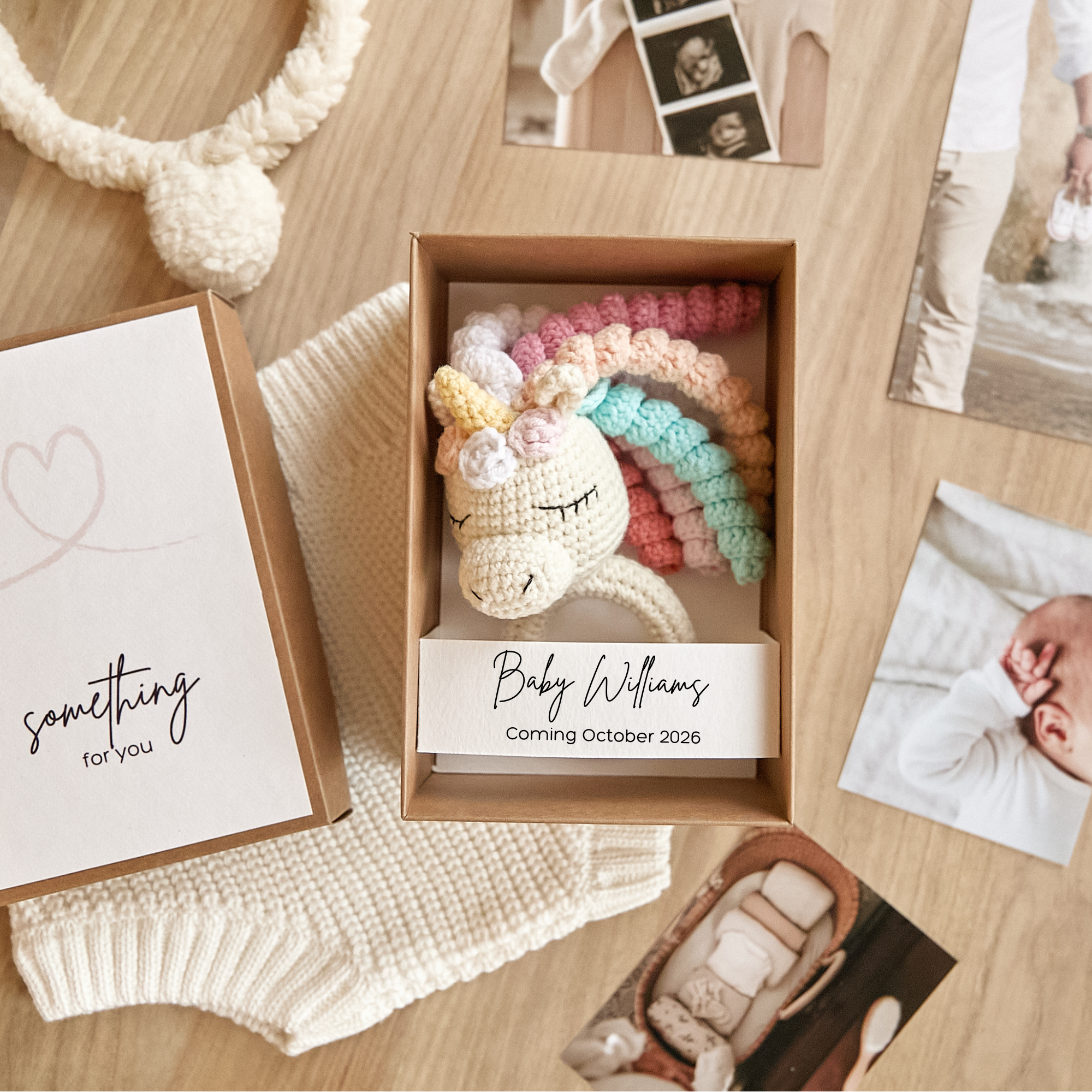 Pregnancy announcement box featuring crochet unicorn toy — magical baby reveal