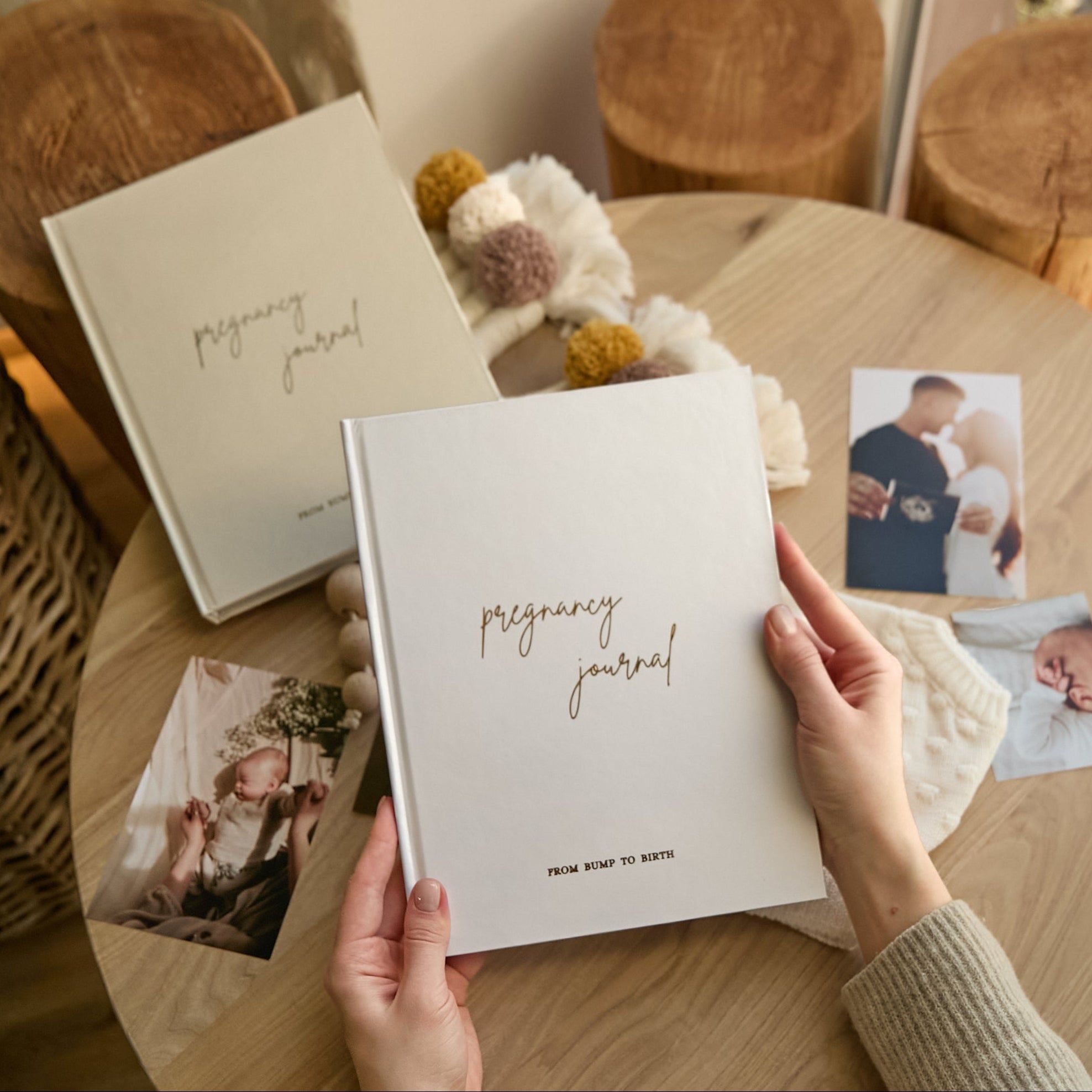 Pregnancy diary on bedside table lifestyle shot in cozy bedroom setting