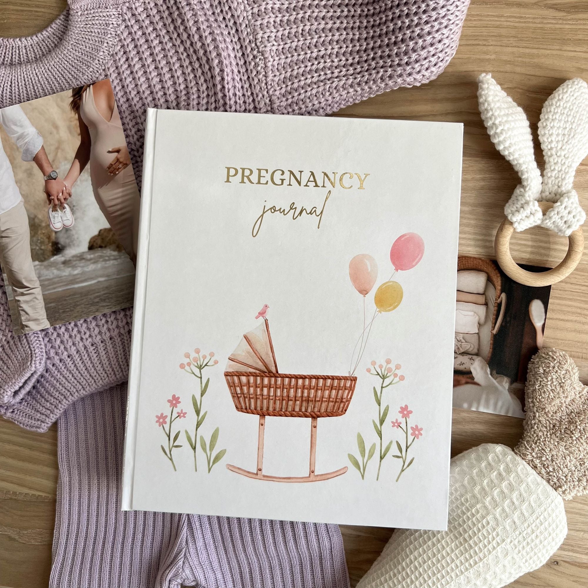 Pregnancy journal cover with pink cradle design — expecting baby girl edition
