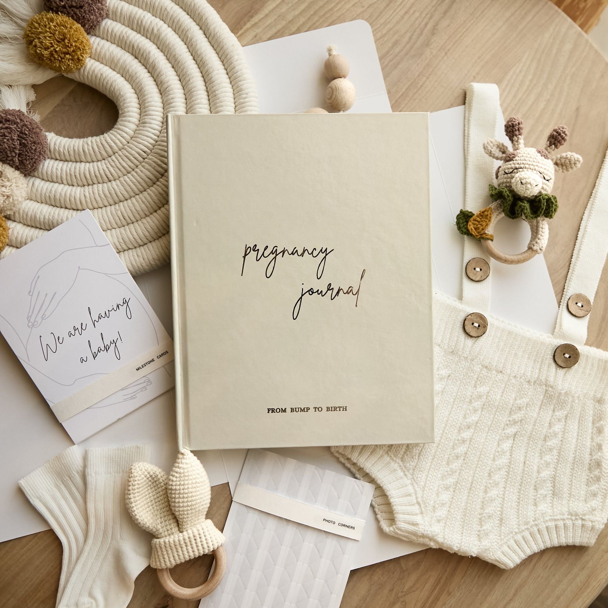 Pregnancy journal held in hands showing book size and premium cover quality
